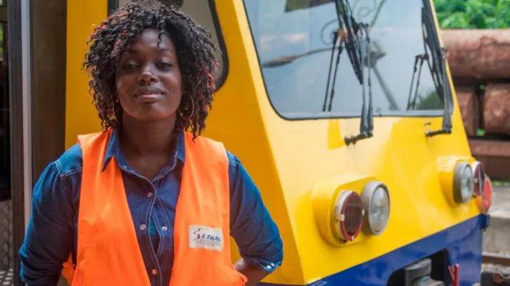 woman by a train in gabon